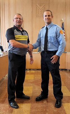 Boone Mayor John Slight welcomes Nicholas Upah to the Boone Fire Department at Monday's City Council Meeting