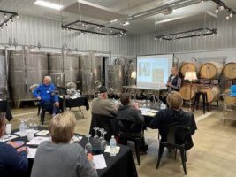 Wine Wednesday workshop offered at Soldier Creek Winery in November 2021. Anne Zwink, the winemaker of Soldier Creek Winery, was presenting one of her wines to the audience.