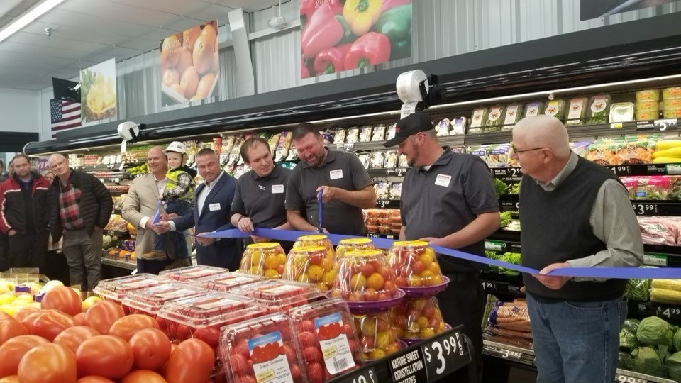 Holding the ribbon, pictured from left to right: Fareway CEO Reynolds W. Cramer, Ogden Fareway Fan Clark Lage, Supervisor Jeff Keinroth, Assistant Store Manager Kawika Gibson, Store Manager Quentin Holder, Market Manager Nathan Campbell, and Mayor Mark Trueblood.