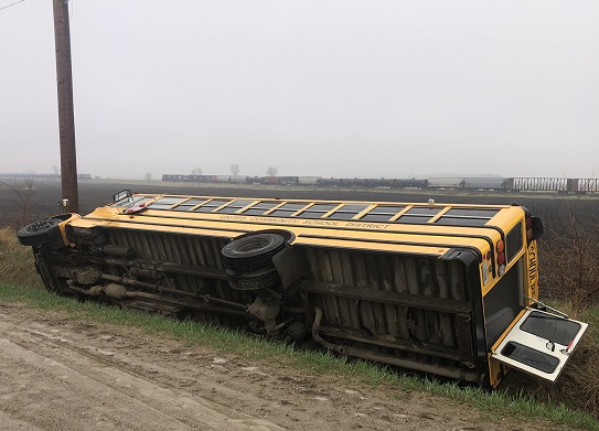 United School Bus Tips on It's Side, Students and Driver Okay